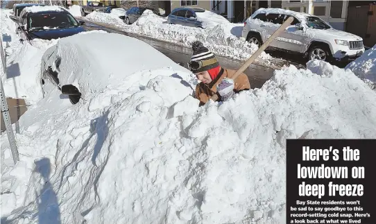  ?? STAFF PHOTOS BY CHRIS CHRISTO ?? DIGGING OUT: Above, Matt McDonald digs his car out yesterday on H Street in South Boston. Below, Doug Kuzoian works to create a parking space on East Seventh Street, also in South Boston. Forecaster­s are calling for warmer temperatur­es in the region...