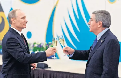  ??  ?? CARA A CARA. El presidente ruso, Vladimir Putin y Thomas Bach, presidente del COI, se ven frente a frente: y no con copas de champán.