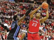  ?? JAY LAPRETE / AP ?? Ohio State’s Zed Key tries to shoot over Duke’s Mark Williams on Tuesday in Columbus. Key scored a career-high 20 points and Ohio State held No. 1 Duke scoreless for the final 4 ½ minutes to beat the Blue Devils 71-66.