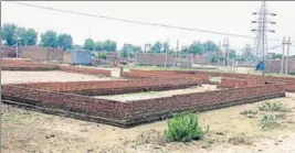  ?? SANJEEV KUMAR/HT ?? Illegal plots carved out by land mafia over the 19 acres of Wakf Board land on the outskirts of Bathinda; and (right) member of a family fleeced by the land mafia with household items kept in the courtyard in the wake of flooding caused by a canal...