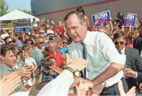  ?? PAUL J. RICHARDS/AFP/GETTY IMAGES ?? David Greenberg says George H.W. Bush was often torn between “the right thing to do versus the political thing to do.”