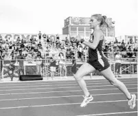  ?? ORLANDO SENTINEL WILLIE J. ALLEN JR./ ?? Winter Springs High School senior Caroline Wells cruised to victory in the 1,600- and 3,200-meter runs in last week’s Class 3A Region 2 track and field meet at East River High School in Orlando.