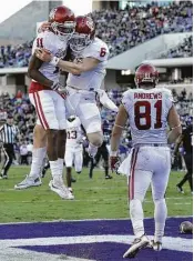  ?? LM Otero / Associated Press ?? Oklahoma wide receiver Dede Westbrook, left, and quarterbac­k Baker Mayfield are walking on air after teaming up on a touchdown pass against TCU.