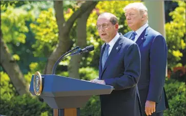  ?? Evan Vucci Associated Press ?? HEALTH SECRETARY Alex Azar, with President Trump, calls short-term health plans a “more affordable option,” but critics warn that skimpier plans won’t provide consumers with a full set of benefits.