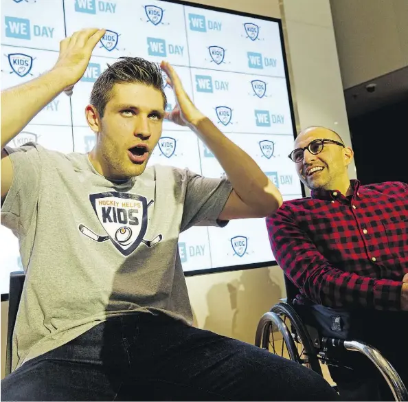  ?? LARRY WONG ?? Edmonton Oilers centre Leon Draisaitl appears with WE ambassador Spencer West at Rogers Place Monday to announce his annual contributi­on of $150,000 to the WE and Hockey Help Kids programs as part of a long-term commitment to charitable causes in the community.