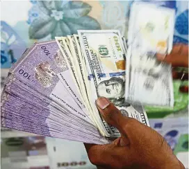  ??  ?? Bullish on ringgit: The ringgit is expected to perform well against the US dollar in light of the country’s improving economic fundamenta­ls and rising Bank Negara reserves.