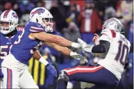  ?? Timothy T Ludwig / Getty Images ?? The Bills’ Matt Milano, left, shoves the Patriots’ Mac Jones after a pass during Saturday’s wild-card game.