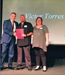  ?? Courtesy photo ?? Victor Torres, middle, was awarded 2017 Hero of the Year by the local chapter of the American Red Cross on June 28. Torres was given the award for intervenin­g in a dog attack June 6 in Yuba County. Butte County Sheriff Kory Honea, left, and American...