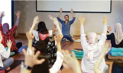  ??  ?? The class breathing out their stress and troubles.