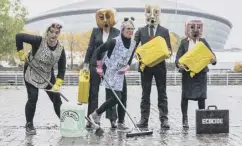  ?? ?? Activists wearing oil can heads and fake oil, at the Hydro