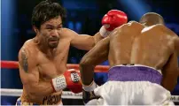  ?? AFP ?? Pacquiao (left) is a clear favourite against Horn. —