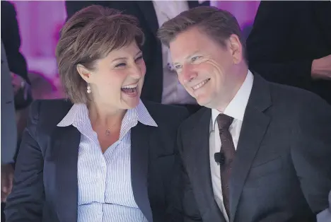  ?? DARRYL DYCK/ THE CANADIAN PRESS ?? British Columbia Premier Christy Clark and Telus Corp. president and CEO Darren Entwistle share a laugh before he announced a $1-billion investment in 2015 to connect the majority of homes and businesses in Vancouver directly to a gigabit fibre optic...