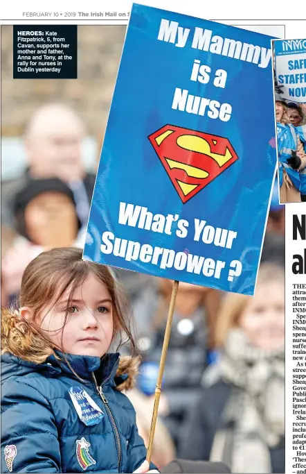  ??  ?? Heroes: Kate Fitzpatric­k, 5, from Cavan, supports her mother and father, Anna and Tony, at the rally for nurses in Dublin yesterday