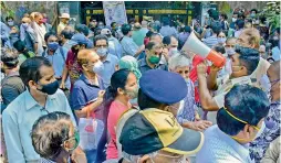  ?? PTI ?? Citizens wait to be vaccinated at a centre amid shortage of Covid-19 vaccines, in Thane on Thursday. —