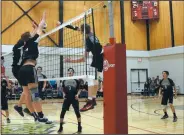  ?? NEWS PHOTO SEAN ROONEY ?? Chris Byam of Senator Gershaw hits on match point off the block of two Hat High Mohawks Wednesday. The ball went out of bounds for the winning point in the South East Zone Volleyball League varsity boys title match.