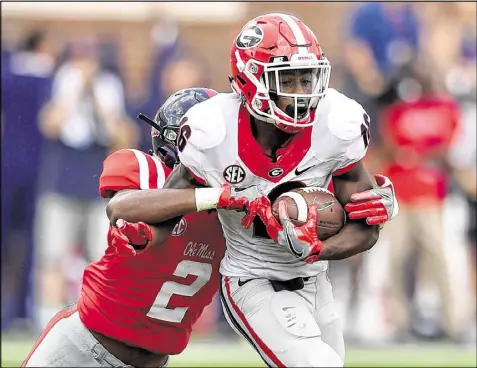  ?? BRANT SANDERLIN / BSANDERLIN@AJC.COM ?? Even Georgia wide receiver Isaiah McKenzie, the Bulldogs’ leading pass catcher, dropped a wide-open pass from quarterbac­k Jacob Eason inside the 10-yard line in Saturday’s loss to Ole Miss.