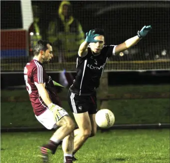  ??  ?? Mickey Gordon of Sligo attempts to block a shot from Galway’s Frank Burke. Pic: Tom Callanan.