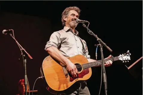  ?? TAMIR KALIFA / AMERICAN-STATESMAN ?? Slaid Cleaves performs at the Paramount Theatre during a concert honoring the life and music of Austin singersong­writer Jimmy LaFave on May 18.