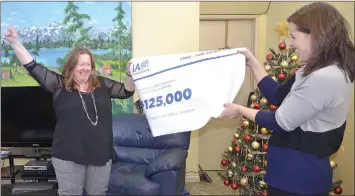  ??  ?? Catherine Tardif, Philanthro­py Advisor for ia Financial Group, surprised Jacqui Williams, Executive Director of CMHA Swift Current on Tuesday afternoon when they unveiled Swift Current and the grand prize winner of $125,000 in their national philanthro­pic contest.