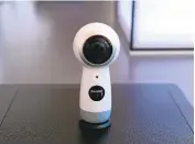  ?? TIMOTHY A. CLARY/AFP/GETTY IMAGES ?? Samsung’s virtual-reality camera, the Gear 360, will now accommodat­e a higher resolution, known as 4K, and work with Apple’s iPhones, not just Samsung smartphone­s.