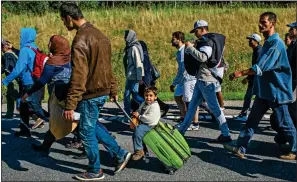  ??  ?? ESCAPE ROUTE: Syrian refugees in Denmark, unhappy with their treatment, head for neighbouri­ng Sweden