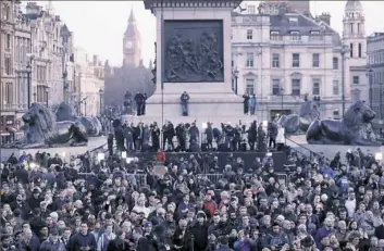  ?? Associated Press ?? Crowds gather at Trafalgar Square in London during a vigil for the victims of Wednesday's attack.