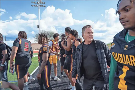  ?? PHOTOS BY MEGAN MENDOZA/THE REPUBLIC ?? Some of Arizona’s top high school football prospects gather to meet recruiting analyst Tom Lemming at the Desert Mountain High School football field on April 1 in Scottsdale.