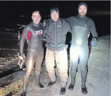  ?? SPECIAL TO THE ST. CATHARINES STANDARD ?? From left, Niagara standup paddlerboa­rders Dan Dakin, Michael Taber and David Postman after completing their journey at Sunset Beach.