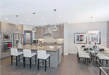  ??  ?? The open-concept main level in the Santiago 5 by Pacesetter is by Sterling Homes in Redstone. The 2,377-square-foot home comes with four bedrooms.