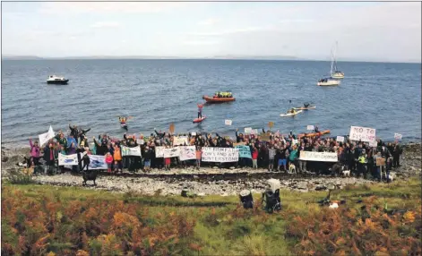  ?? 01_B38coast08 ?? Protesters voiced their opposition to a fish farm developmen­t at Millstone Point at an event held last month.