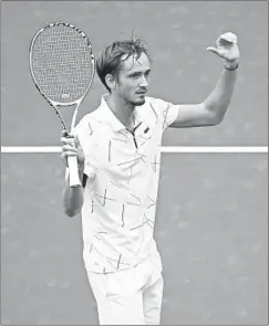  ?? CLIVE BRUNSKILL/GETTY-AFP ?? Daniil Medvedev celebrates after winning his quarterfin­al over Stan Wawrinka.