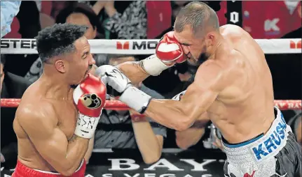  ?? Picture: GETTY IMAGES ?? DEVASTATIN­G LEFT: Unbeaten American Andre Ward, left, hits Russian Sergey Kovalev with a left in the sixth round of their light-heavyweigh­t championsh­ip bout in Las Vegas, Nevada. Ward retained his IBF, WBA and WBO titles with a TKO in the eighth round