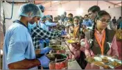  ?? PTI ?? Food distribute­d among students at Akshaya Patra mid-day meal kitchen