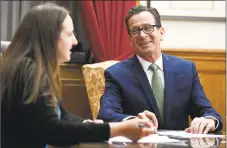  ?? Jessica Hill / Associated Press ?? Gov. Dannel P. Malloy works on his speech for his final legislativ­e session Wednesday with Communicat­ions Director Kelly Donnelly in his office at the state Capitol in Hartford.