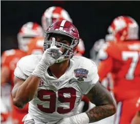  ?? Butch Dill / Associated Press ?? Lineman Raekwon Davis and the Alabama defense silenced Clemson, holding the Tigers to 188 total yards Monday night.