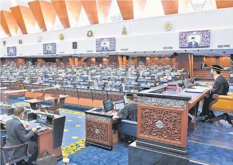  ?? — Bernama photo ?? The Dewan Rakyat in session yesterday. The si ing was adjourned at 1pm amid concerns of the spread of Covid-19.