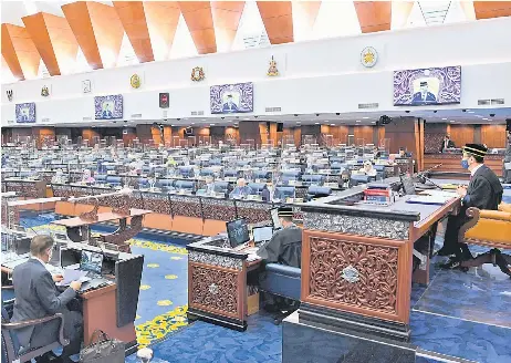  ?? — Bernama photo ?? The Dewan Rakyat in session yesterday. The si ing was adjourned at 1pm amid concerns of the spread of Covid-19.