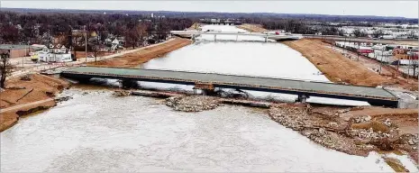  ??  ?? A large water main that runs under the Great Miami River broke late Wednesday, cutting water service to much of Montgomery County. The city of Dayton was able to bypass the break and most service was restored by Thursday morning.