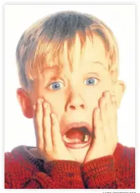  ?? 20TH CENTURY FOX ?? Macaulay Culkin starred in the 1990 holiday blockbuste­r “Home Alone” as an 8-year-old who must protect his home from a pair of burglars (Joe Pesci and Daniel Stern) when he is accidental­ly left at home alone by his family during Christmas vacation.