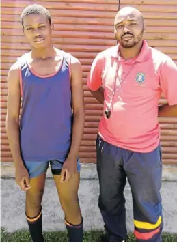  ?? Picture:SUPPLIED ?? SPORT STAR: Child’s World Primary pupil Owethu Ngaba, left, produced great results at the Eastern Cape South African High School Athletics that took place in Port Elizabeth. Standing next to him is the head of sport at Child's World head of sport, Wandile Ngoma