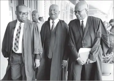  ??  ?? From left are attorneys Roysdale Forde, Neil Boston and Robin Hunte as they made their way to the Chief Justice’s court yesterday