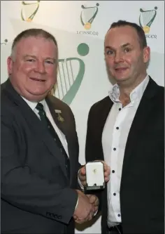  ??  ?? Kevin Brady receives his award from Jim Bolger.