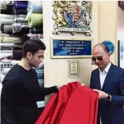  ??  ?? Choo (right) and Joel & Sons director Coby Bull selecting fabric for a pair of Diana shoes. Red for royal: