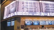  ?? Wayne Parry / Associated Press ?? A customer ponders the odds at the sportsbook at Bally's casino in Atlantic City, N.J.