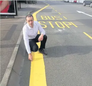  ??  ?? Pictured is Coun Ted Parton with the newly-painted bus stop in Southfield Road.