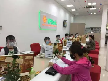  ?? Photo courtesy of Vpbank ?? Customers at a branch of Vpbank (VPB) in Hà Nội. VPB rose 5.7 per cent on Friday.