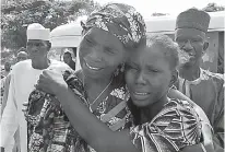  ?? AP Photo/Olamikan Gbemiga ?? On Saturday, a woman embraces a relative, one of the released kidnapped schoolgirl­s, in Abuja, Nigeria.