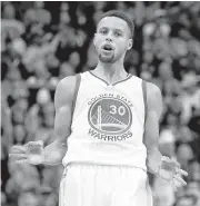  ?? RICK SCUTERI/ASSOCIATED PRESS ?? Stephen Curry reacts after one of his seven 3-pointers in the first half. He finished with 41 points in just three quarters.