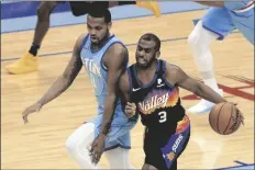  ?? ASSOCIATED PRESS ?? PHOENIX SUNS GUARD CHRIS PAUL (3) collides with Houston Rockets guard Sterling Brown during the second half of a game on Wednesday in Houston.