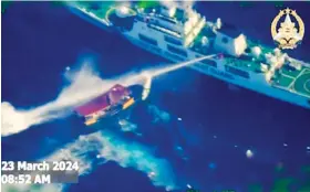  ?? / ARMED FORCES OF THE PHILIPPINE­S VIA AP ?? IN THIS screen grab from video provided by the Armed Forces of the Philippine­s, a Chinese Coast Guard ship uses water cannons on a Philippine resupply vessel Unaizah May 4 as it approaches Second Thomas Shoal, locally called Ayungin shoal, at the disputed South China Sea on Saturday, March 23, 2024.